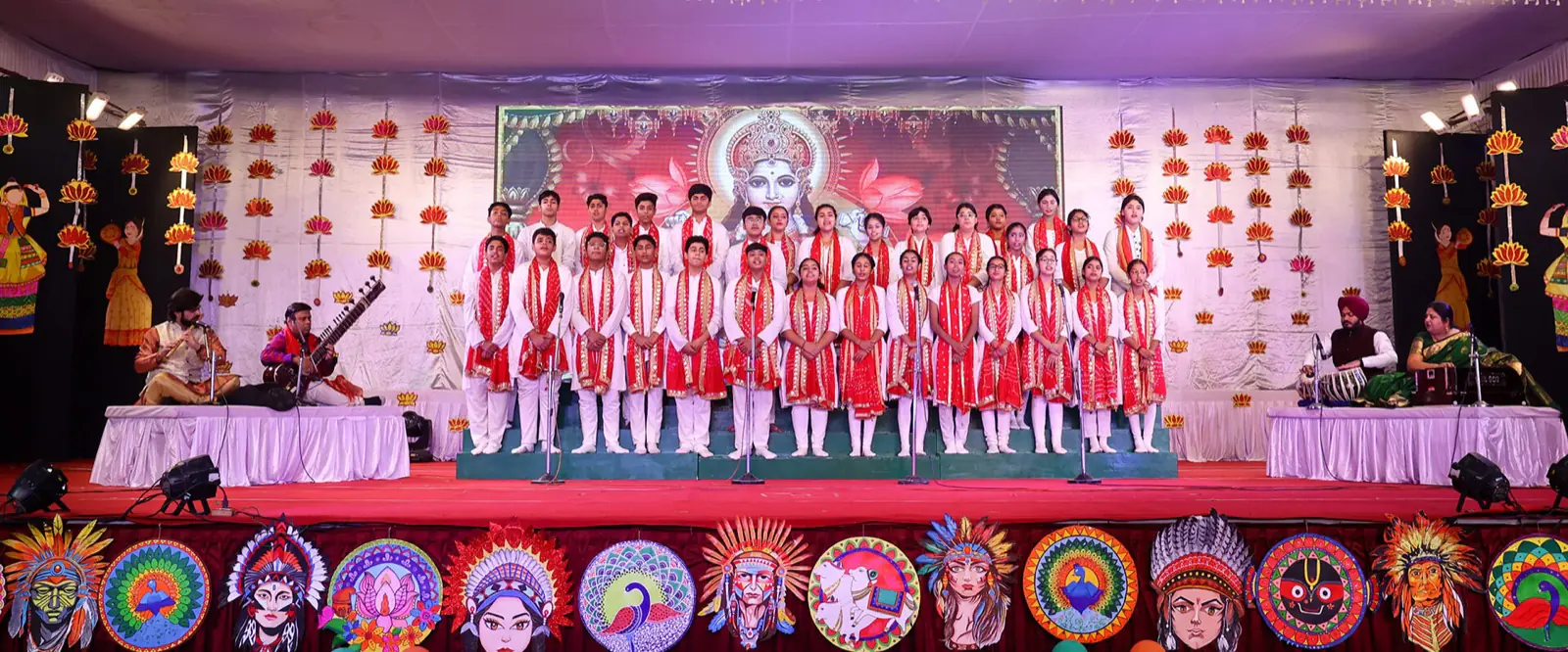 Students singing on stage with live musicians